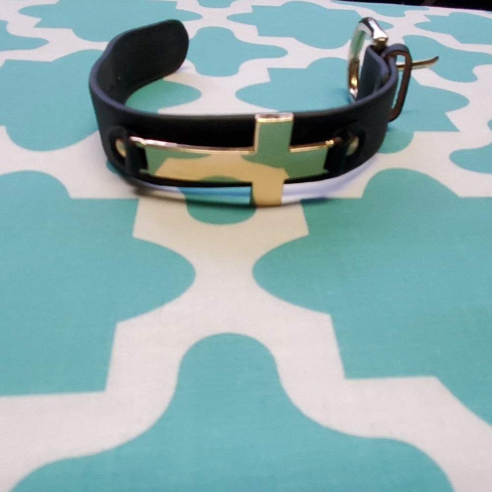 Black cross bracelet.